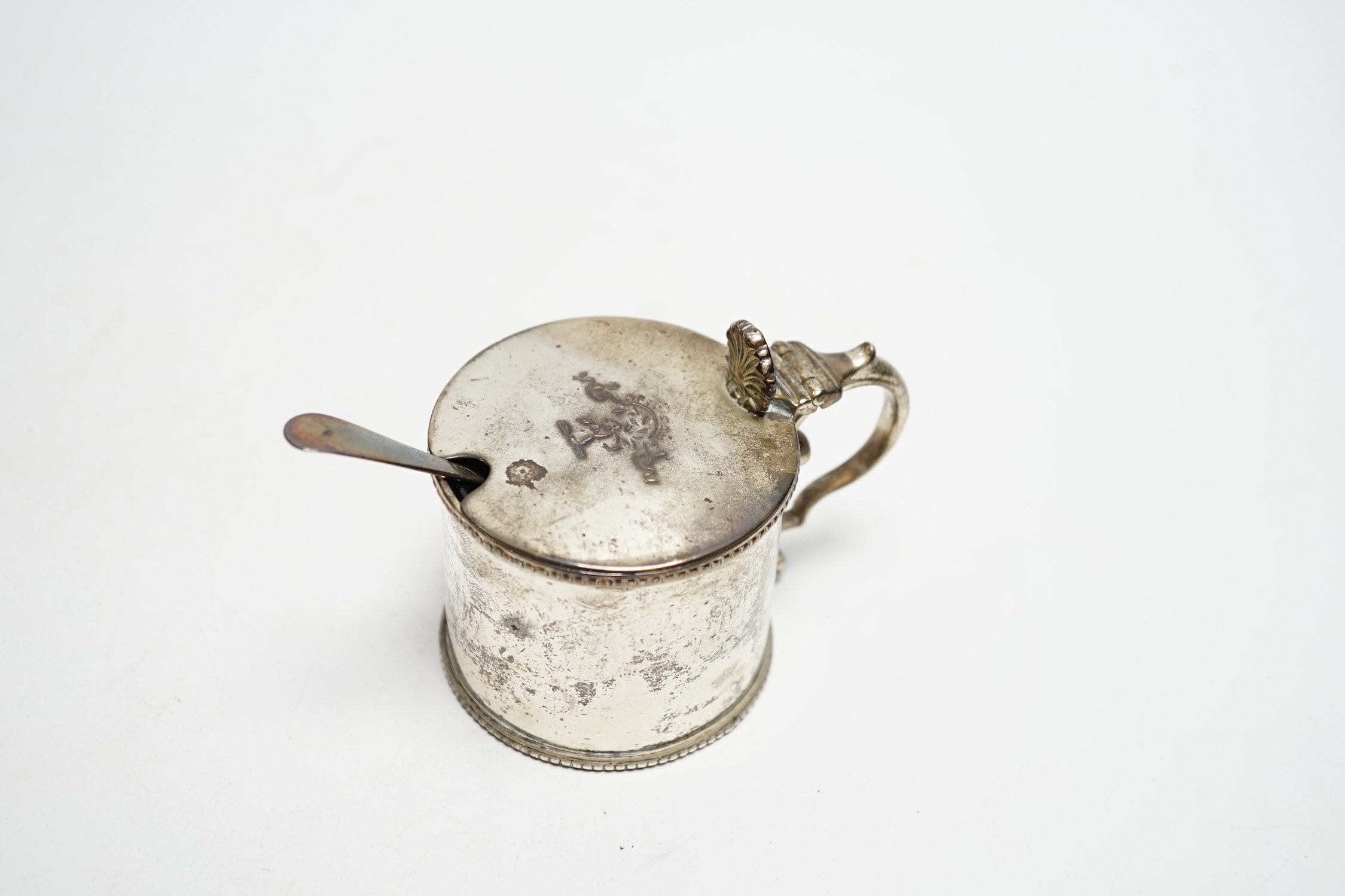 A Victorian Scottish silver drum mustard, James McKay, Edinburgh, 1861, height 72mm, with an earlier associated silver spoon